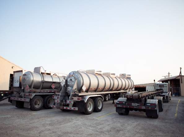 Rear view of waste disposal truck fleet