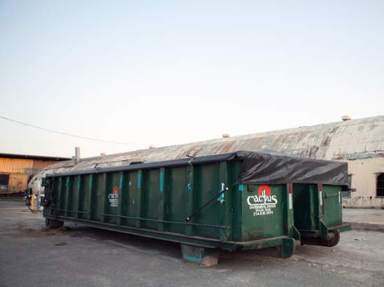Cactus Environmental roll off container in industrial worksite