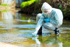 HAZMAT certified worker testing water for contaminants