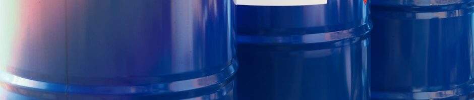 The close-up shot of blue color hazardous dangerous chemical drum barrels. Contact Cactus Environmental Services.