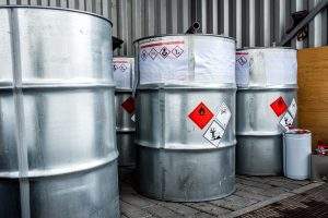large cans of hazardous waste material